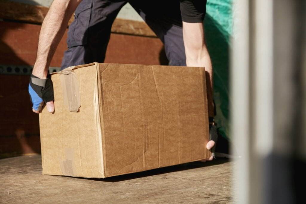 lifting heavy cardboard box