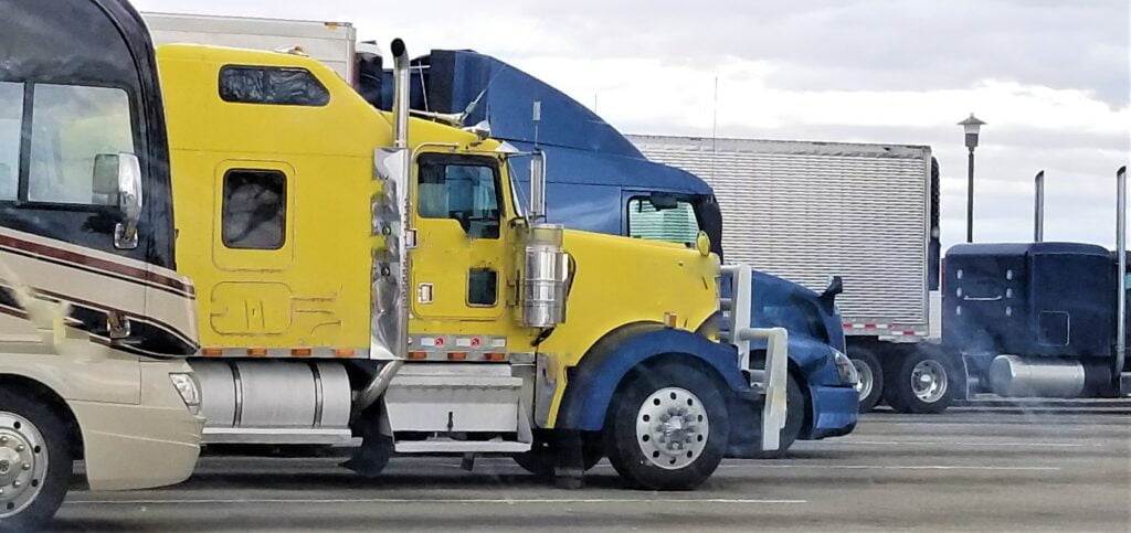 yellow and blue transport trucks