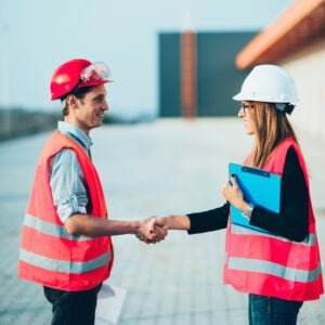 safety workers shaking hands